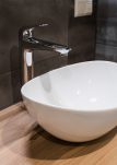 White top ceramic washbasin with glossy metal mixer